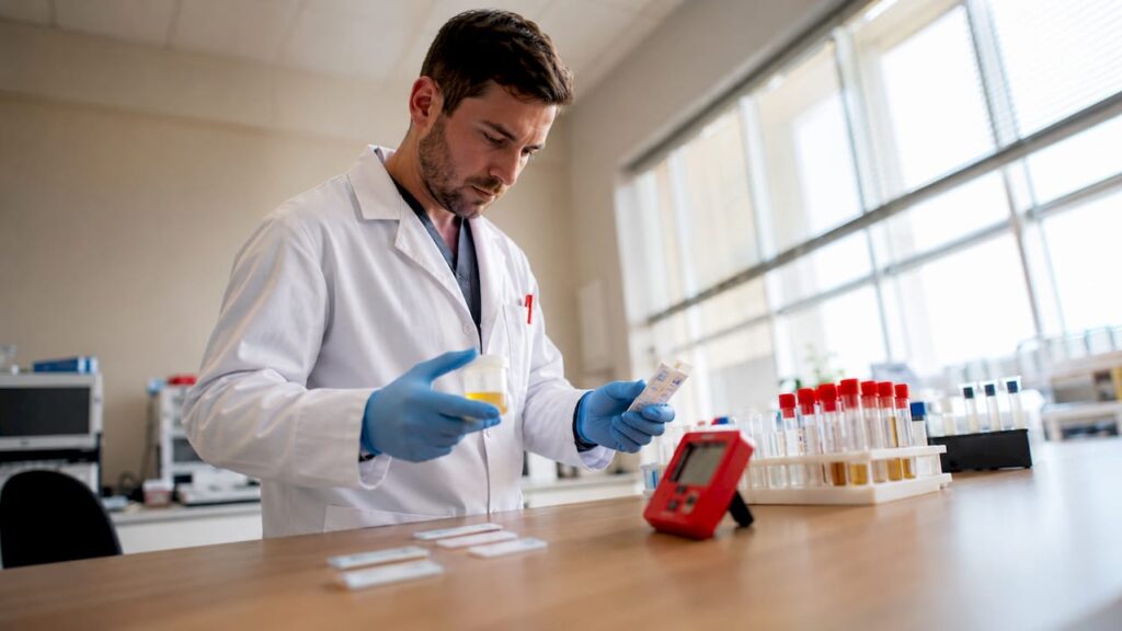 Technician handling drug test samples