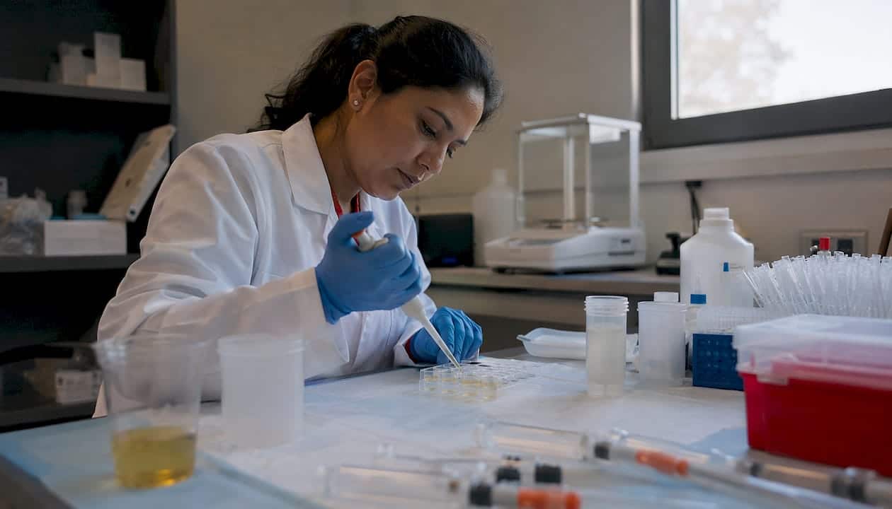 Lab technician performing quality control testing