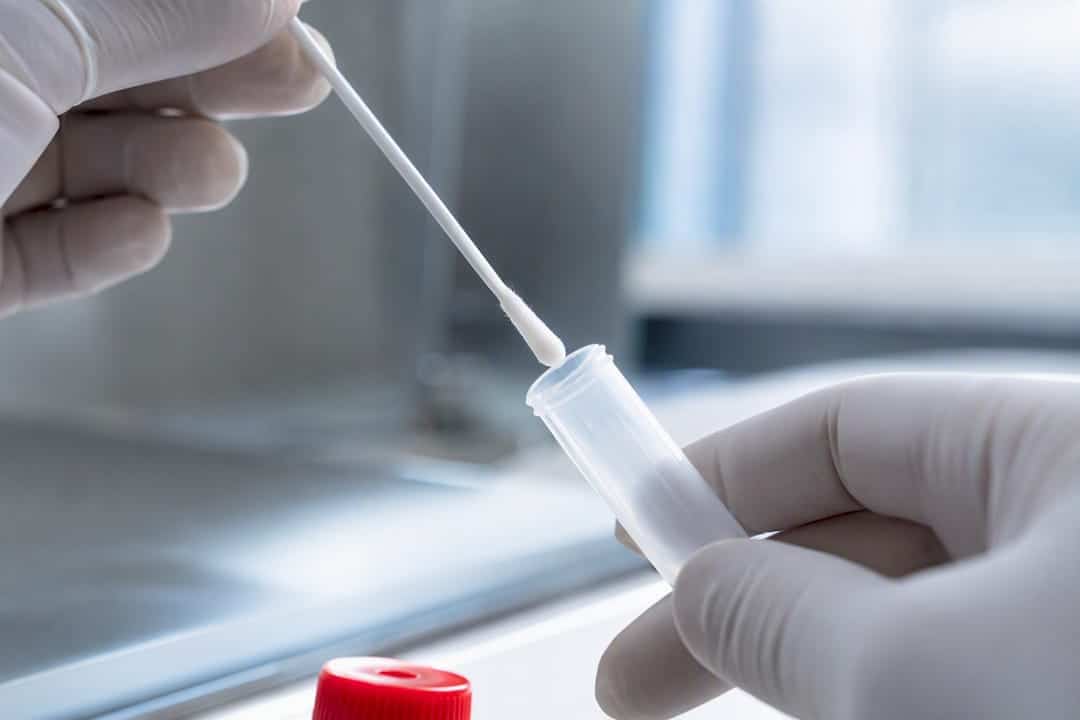 Clinician preparing anonymous oral fluid specimen