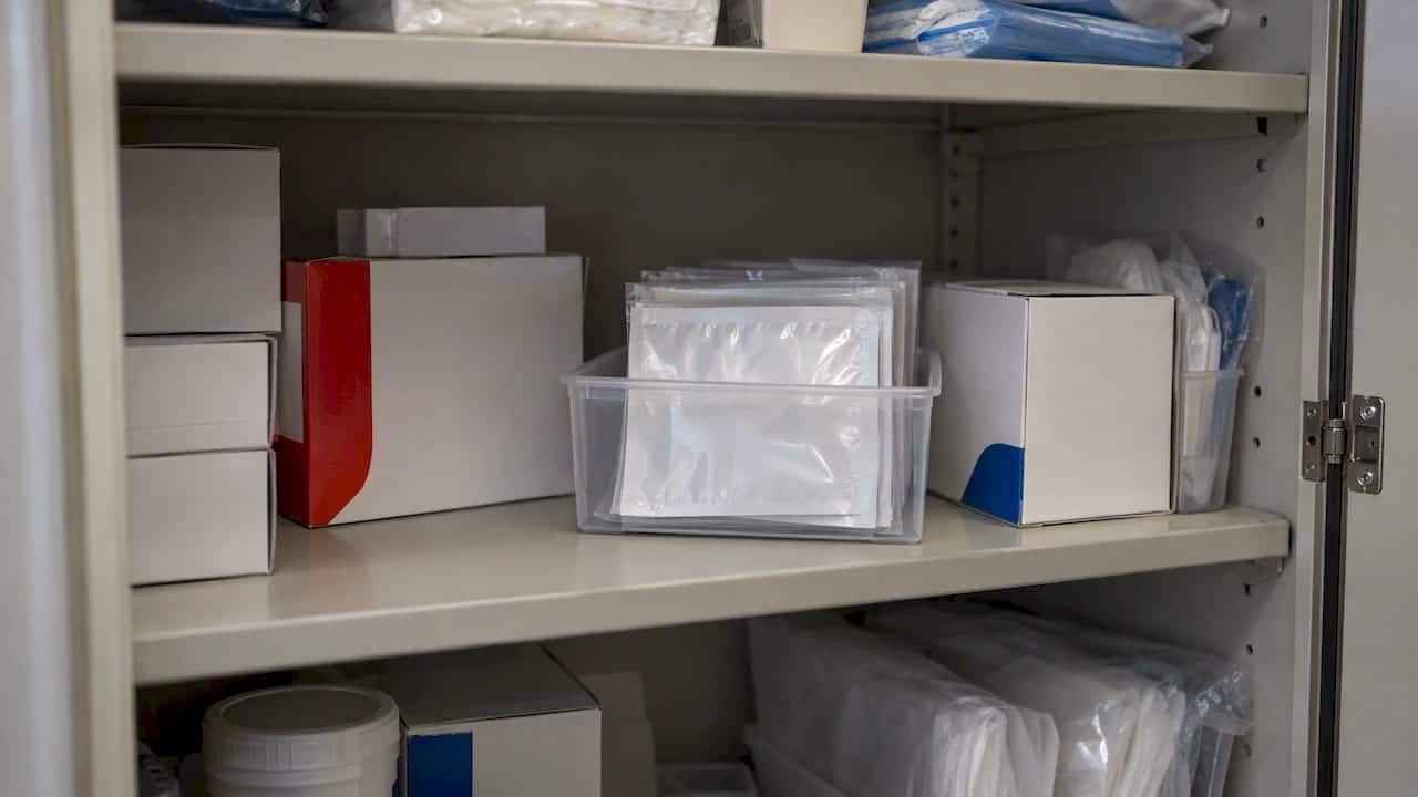Temperature strip packets stored in a cabinet