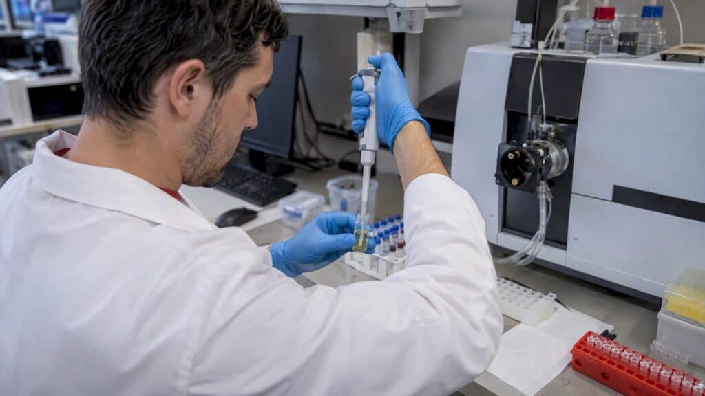 Technologist preparing urine for mass spectrometry